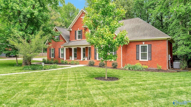 114 Spring Water Dr, Madison, AL 35758 - view of front of house with a front lawn, brick siding, and a porch