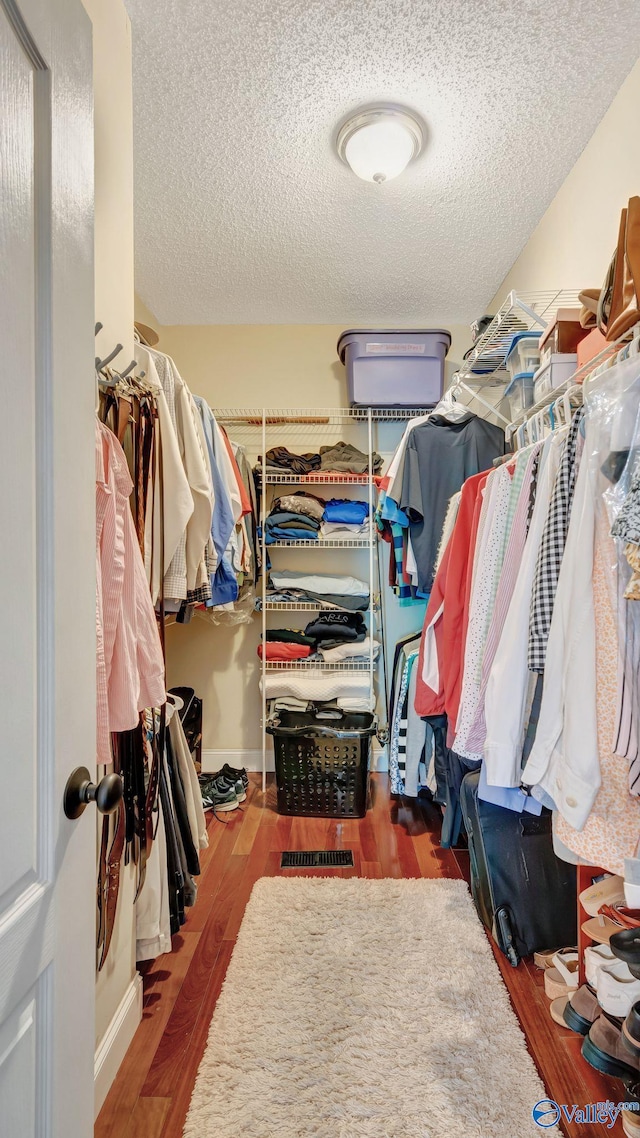 114 Spring Water Dr, Madison, AL 35758 - walk in closet with wood finished floors