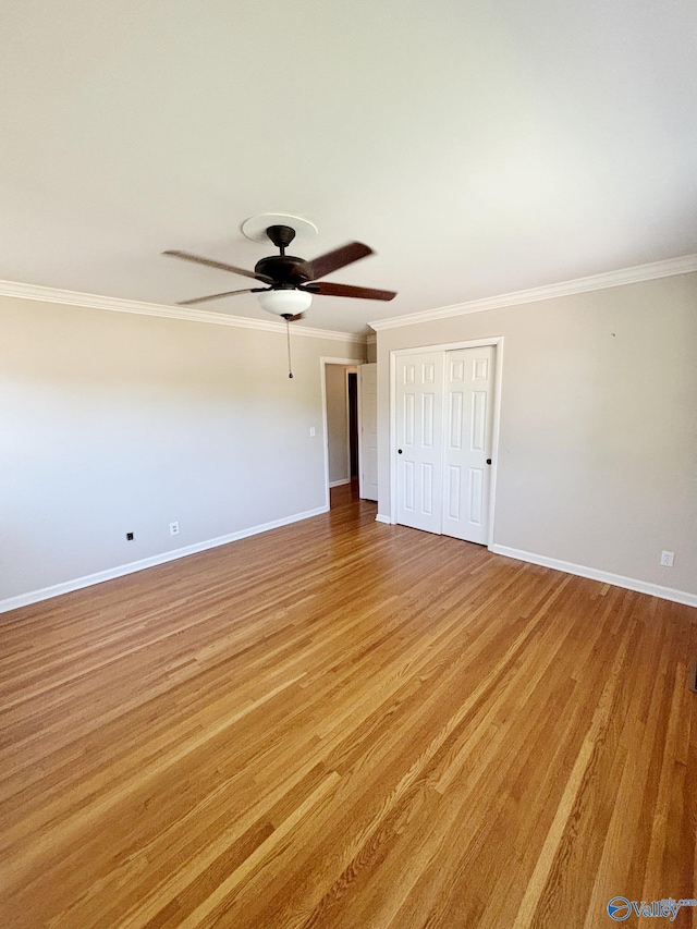 5627 SW Alta Dena St, Huntsville, AL 35802 - spare room with baseboards, a ceiling fan, crown molding, and light wood-style floors