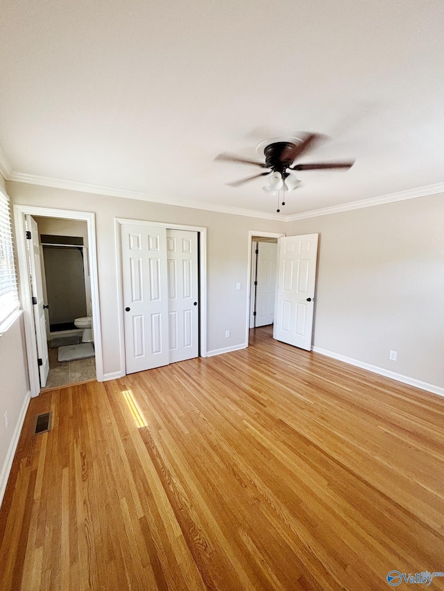 5627 SW Alta Dena St, Huntsville, AL 35802 - unfurnished bedroom featuring light wood-style floors, crown molding, baseboards, ensuite bath, and ceiling fan