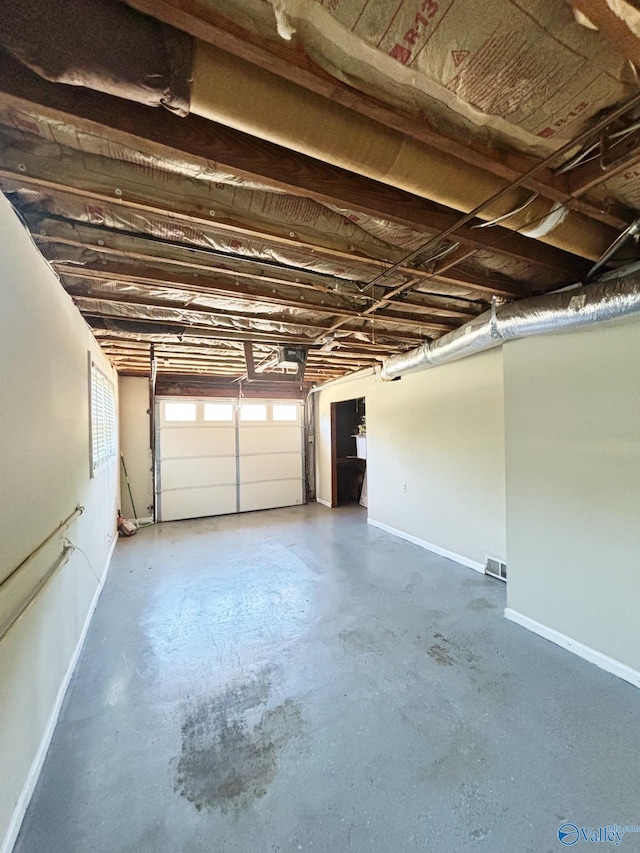 5627 SW Alta Dena St, Huntsville, AL 35802 - garage featuring baseboards