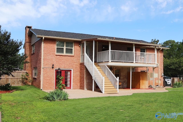 5627 SW Alta Dena St, Huntsville, AL 35802 - back of house featuring a chimney, brick siding, a patio area, and stairway