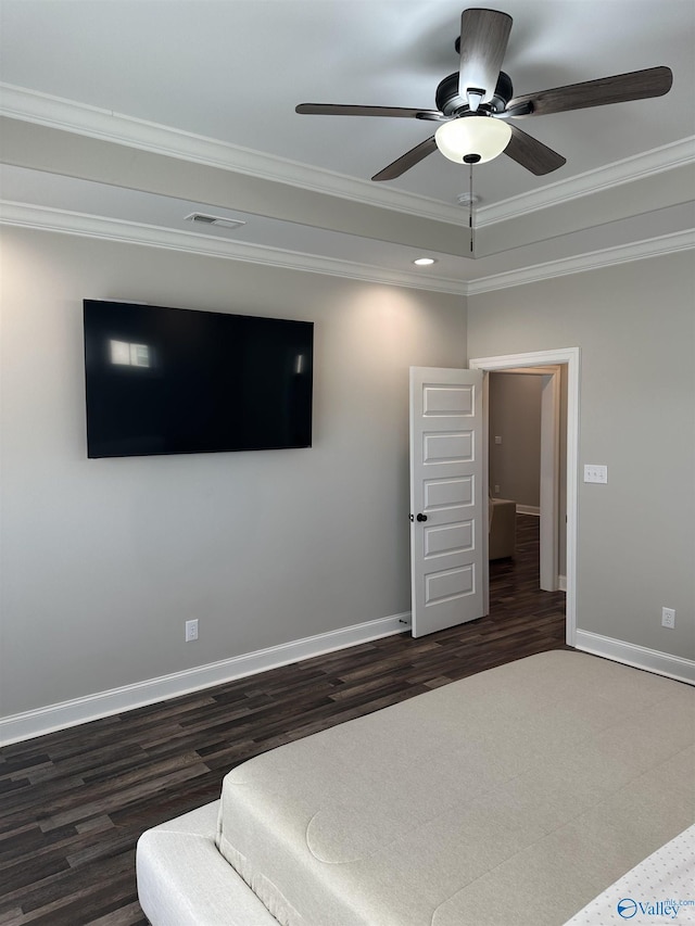 bedroom with crown molding, dark wood-type flooring, and ceiling fan