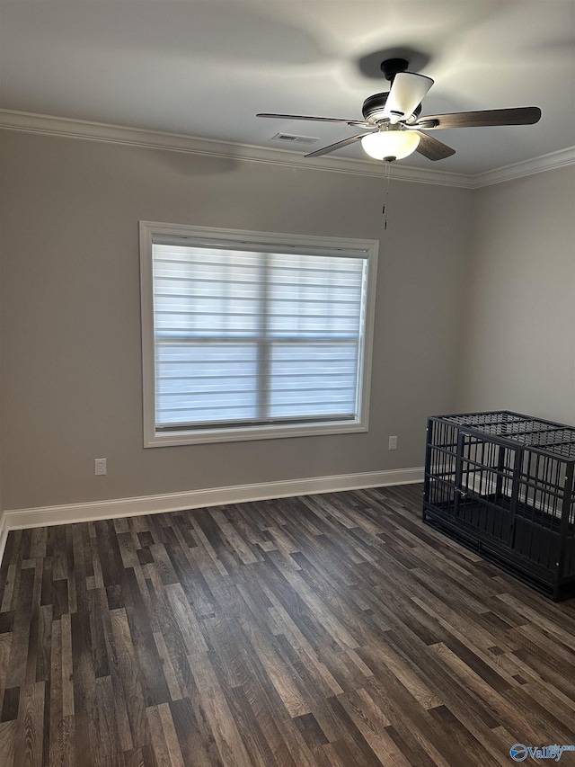 unfurnished bedroom with ceiling fan, ornamental molding, and dark hardwood / wood-style flooring