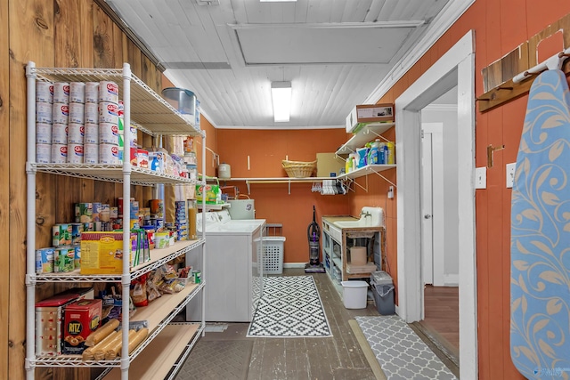 washroom featuring laundry area, washer / dryer, and wood finished floors