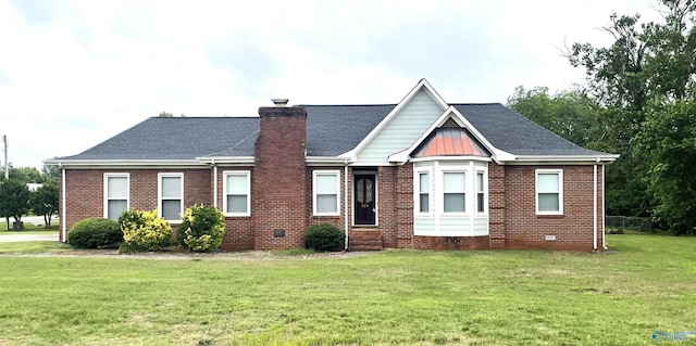 118 Hazelwood Dr, Hazel Green, AL 35750 - view of front of house with brick siding, a front lawn, and a chimney