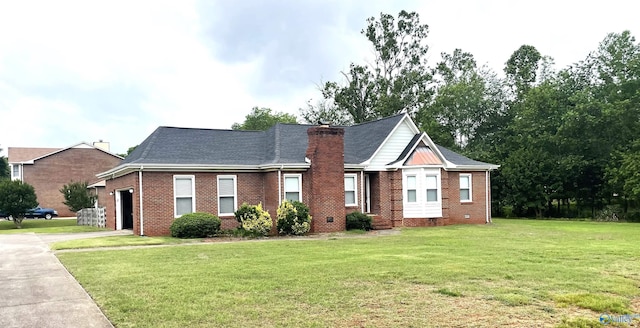 118 Hazelwood Dr, Hazel Green, AL 35750 - view of front of property with a garage, brick siding, a front lawn, concrete driveway, and a chimney