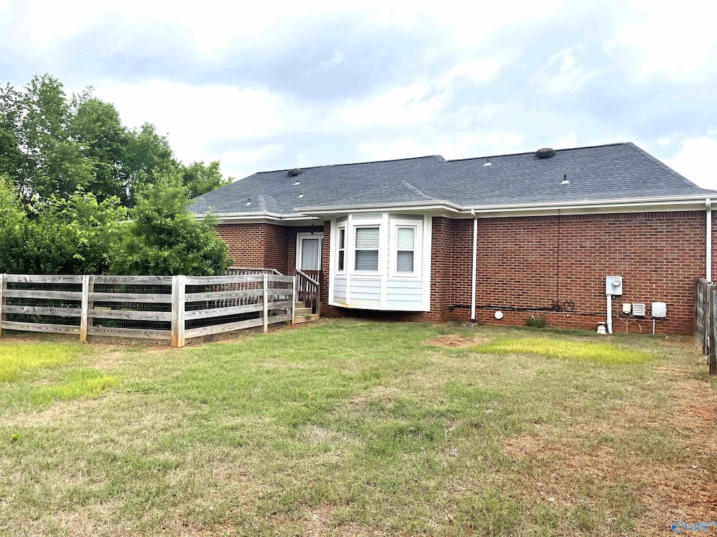 118 Hazelwood Dr, Hazel Green, AL 35750 - rear view of house featuring brick siding and a shingled roof