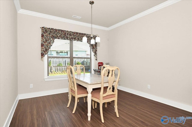 dining room with ornamental molding, dark hardwood / wood-style flooring, and a notable chandelier