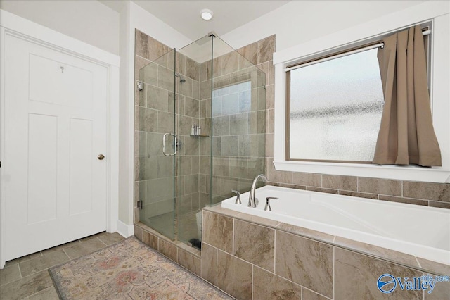 bathroom featuring plus walk in shower