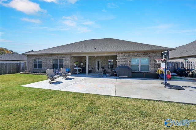 rear view of property with a lawn