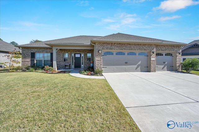 view of front of house with a garage and a front yard