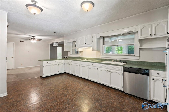 kitchen featuring a ceiling fan, a sink, stainless steel dishwasher, a peninsula, and white cabinets
