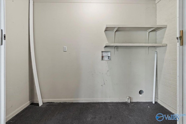 washroom with hookup for a washing machine, carpet flooring, and laundry area