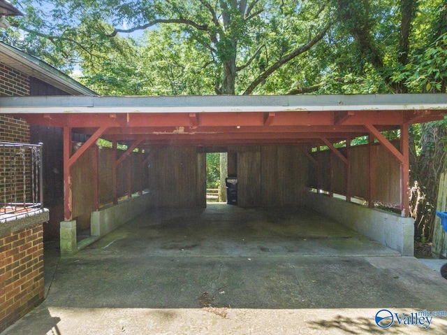 exterior space featuring an attached carport and concrete driveway