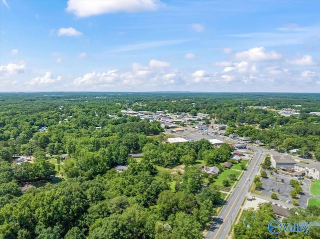 bird's eye view featuring a wooded view