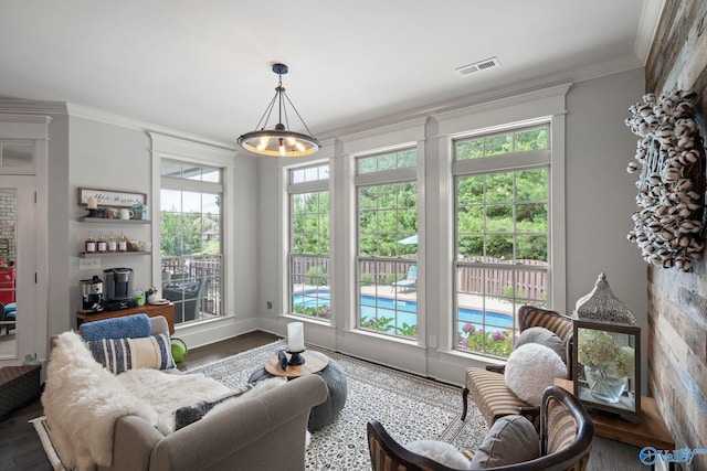 155 Holbrook Dr, Huntsville, AL 35806 - living room featuring wood finished floors, plenty of natural light, a chandelier, and crown molding