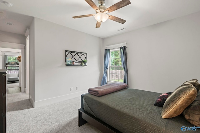 155 Holbrook Dr, Huntsville, AL 35806 - bedroom featuring carpet flooring, access to exterior, and a ceiling fan