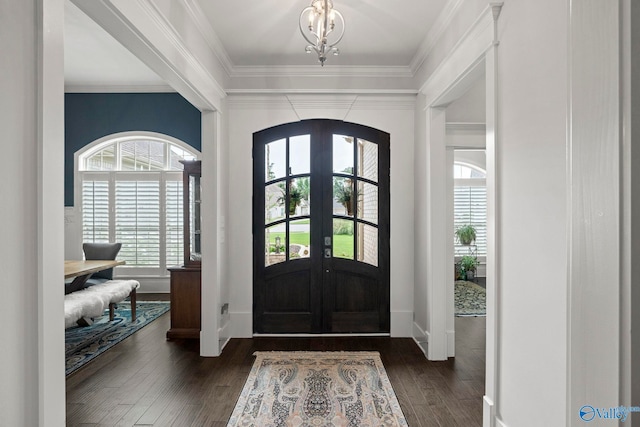 155 Holbrook Dr, Huntsville, AL 35806 - foyer featuring crown molding, a chandelier, arched walkways, dark wood-type flooring, and french doors