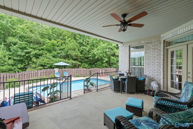 155 Holbrook Dr, Huntsville, AL 35806 - fenced backyard with a patio, a ceiling fan, and outdoor dining area