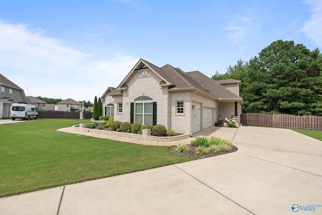 155 Holbrook Dr, Huntsville, AL 35806 - view of front of home with concrete driveway, brick siding, an attached garage, and a shingled roof