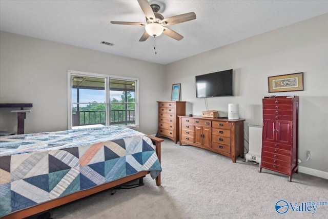 bedroom featuring visible vents, baseboards, light colored carpet, ceiling fan, and a textured ceiling