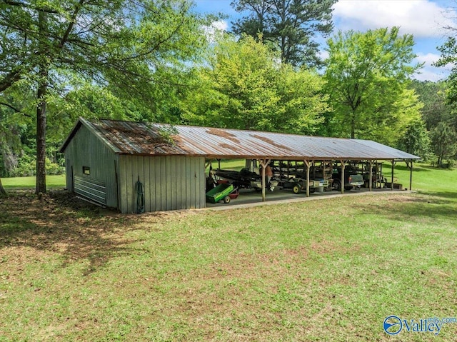 exterior space featuring a carport and a lawn