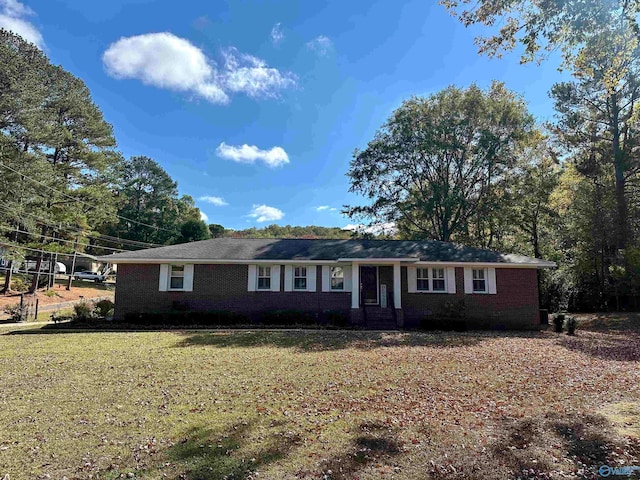 ranch-style home with a front yard