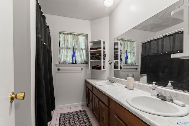 bathroom featuring tile patterned floors and dual bowl vanity