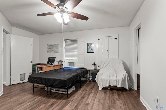 bedroom with pool table, hardwood / wood-style floors, and ceiling fan