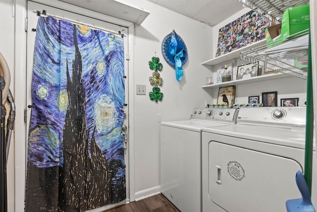 laundry area featuring a textured ceiling, dark hardwood / wood-style flooring, and independent washer and dryer