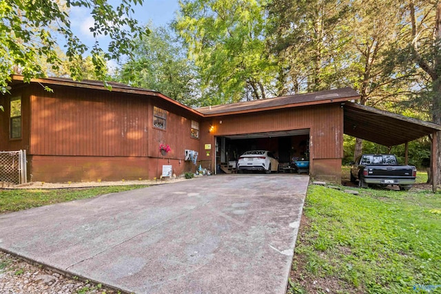 exterior space featuring a carport and a yard