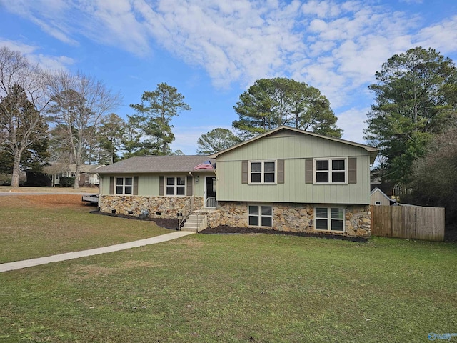 split level home featuring a front lawn