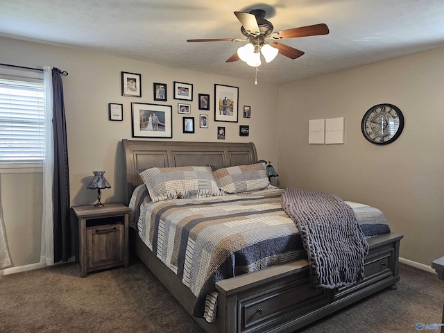 bedroom with dark carpet and ceiling fan