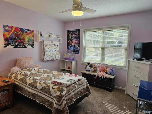 carpeted bedroom featuring a textured ceiling and ceiling fan