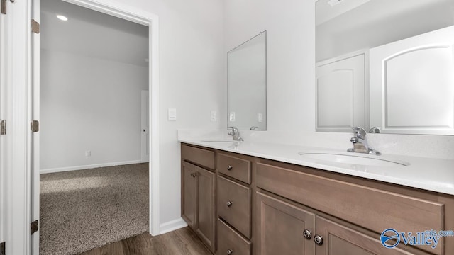 bathroom featuring vanity and hardwood / wood-style floors
