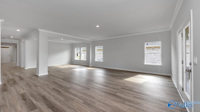 interior space featuring crown molding and hardwood / wood-style flooring