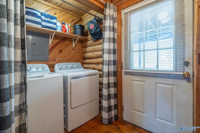 laundry area featuring rustic walls, separate washer and dryer, wood walls, wood-type flooring, and wood ceiling