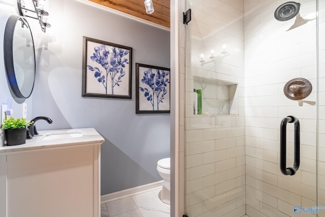 bathroom with vanity, an enclosed shower, and toilet