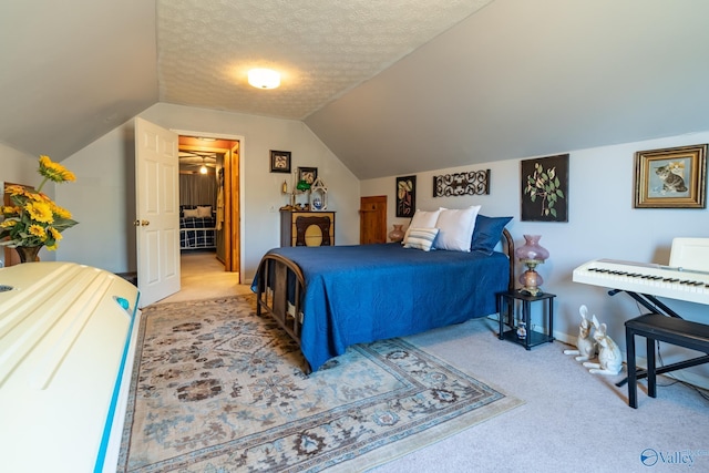 carpeted bedroom featuring lofted ceiling and a textured ceiling