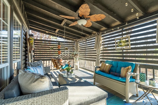 wooden deck featuring outdoor lounge area and ceiling fan