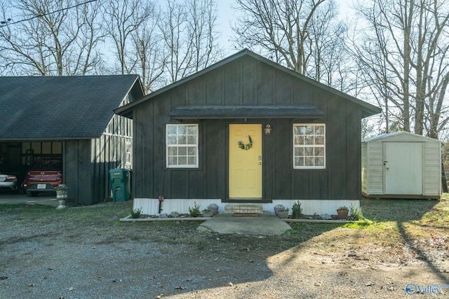 view of front of home featuring a storage unit