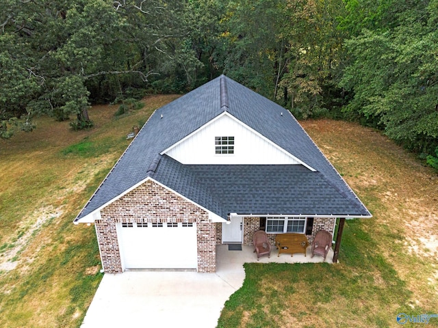 exterior space featuring a garage and a front yard