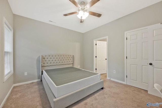 carpeted bedroom featuring ceiling fan