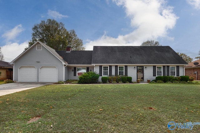 single story home featuring a garage and a front lawn