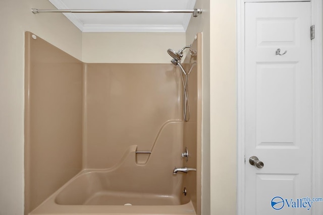 bathroom with shower / tub combination and ornamental molding