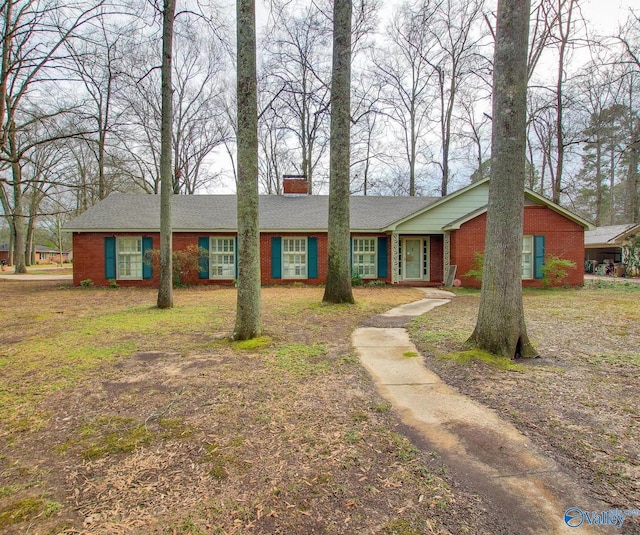 ranch-style home featuring a front yard