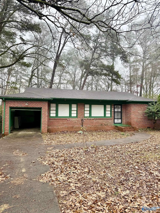 ranch-style home featuring a garage