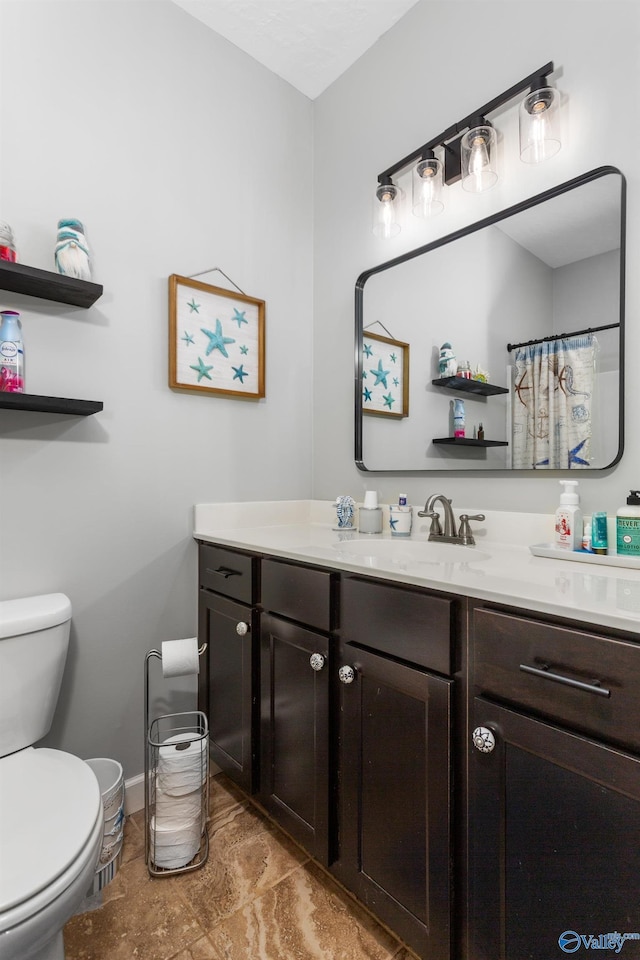 7110 New Bethel Rd, Hokes Bluff, AL 35903 - full bathroom with toilet, vanity, and baseboards