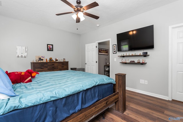 7110 New Bethel Rd, Hokes Bluff, AL 35903 - bedroom featuring wood finished floors, baseboards, and a ceiling fan